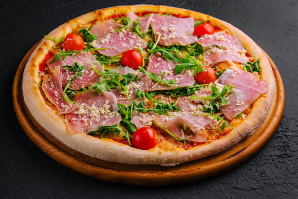 istock Gourmet italian pizza with prosciutto and arugula 2149102537