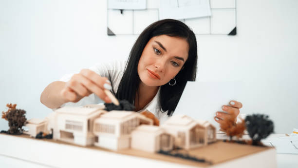 istock Closeup of beautiful architect measure the architectural model. Immaculate. 2149103023