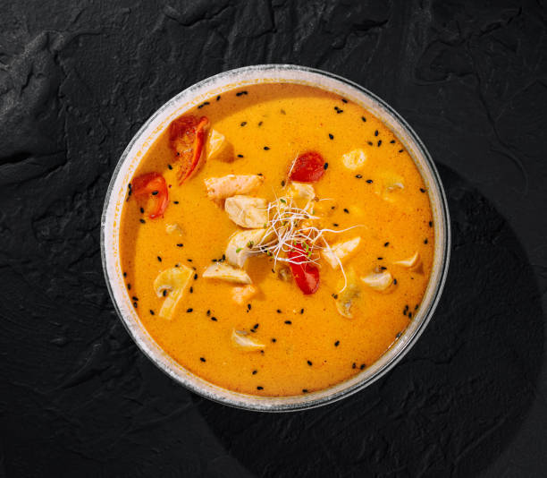 istock Spicy thai chicken curry in bowl on black background 2149103502