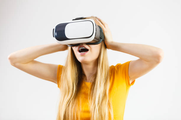 istock Girl wearing virtual reality goggles. 2149103735