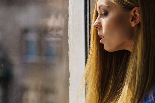 istock Shocked teenage woman looking through 2149104321