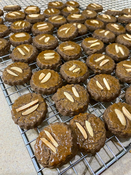 istock homemade chocolate almond cookies on baking rack 2149104566