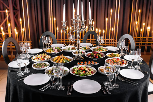 Luxurious banquet table with an array of gourmet dishes, fine china, and glowing candelabra