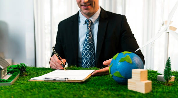 istock Businessman or CEO in office signing environmental regulation. Quaint 2149105509