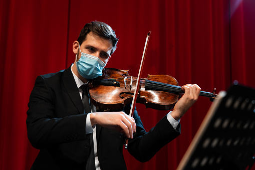 Portrait of a musician playing viola in the theater