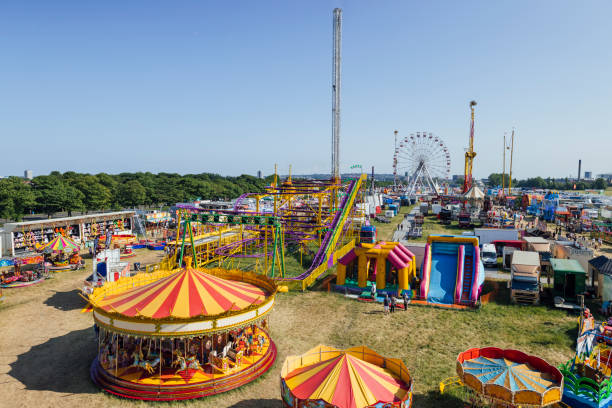 Travelling Carnival Wide shot aerial view of an outdoor travelling carnival with different rides and food stalls in the North East of England.
Videos are available similar to this scenario. amusement park ride stock pictures, royalty-free photos & images
