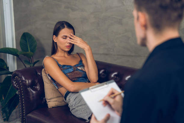 istock Stressed and depressed patient seeking help from psychiatrist. Unveiling 2149106927