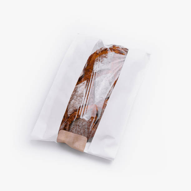 istock Fresh baguette in paper bag isolated on white 2149107246
