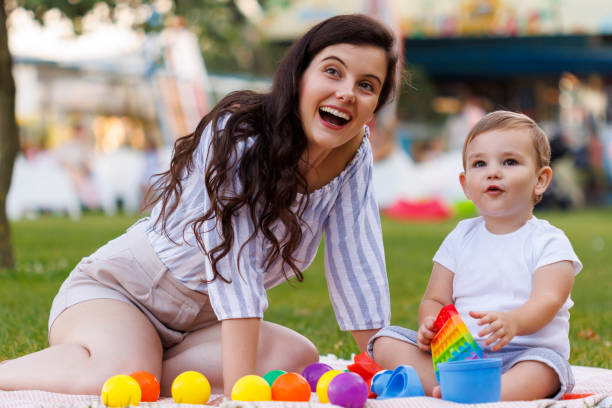istock Mother and child playing while on a picnic in the park 2149107272
