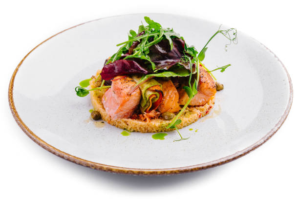 Gourmet salmon dish on white background