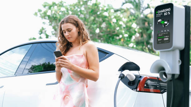 istock Focused charging station recharging EV car on blurred background. Synchronos 2149109082
