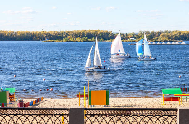 Samara, Russia - September 12, 2015: Sailing yachts floating on the Volga river on a summer sunny day