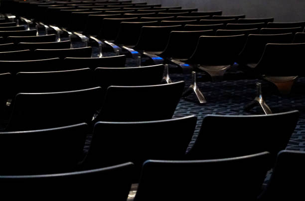 istock Background of seats rows in a dark room 2149112143