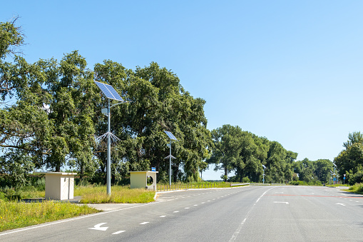 Asphalted highway. Lanterns with solar panels along the road