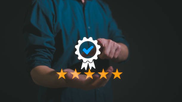 istock Quality management with Quality Assurance or QA and Quality Control or QC and improvement. Businessman hold virtual sign of quality Standardisation and certification with five stars 2149113185