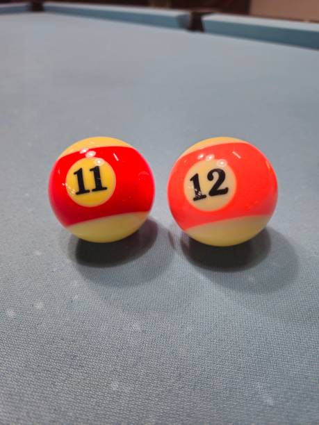 istock Pool balls on gray table sport game billiards known as eight ball pool. 2149113658