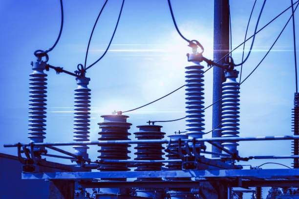High voltage power transformer substation.High voltage electric power transformers in the blue cloudy sky.Toned.