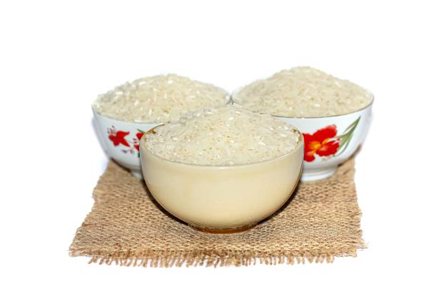 istock White rice in the bowl put on sack with isolated picture style. 2149115829