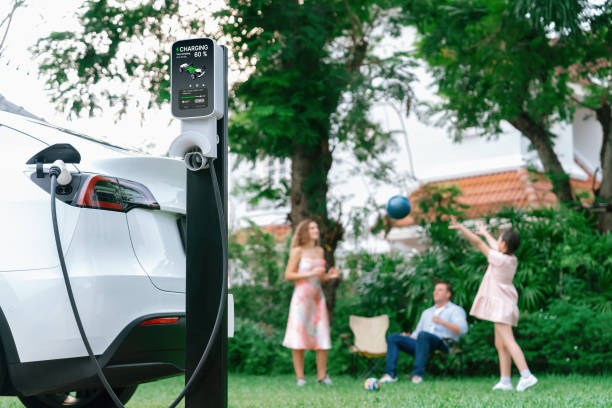istock Focus EV station recharging battery for EV car on blurred family. Synchronos 2149118014