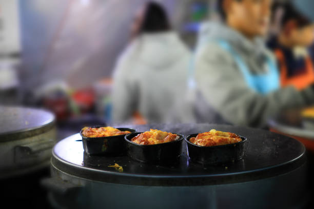This is a sweet, steamy, hot and fluffy little loaf of bread with a whole egg inside. It's sold by street vendors all over Korea.