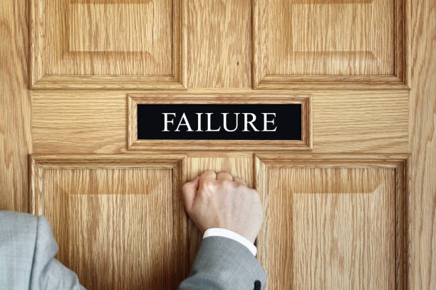 Businessman knocking on the door to Failure in the office concept for failing, mistake or losing