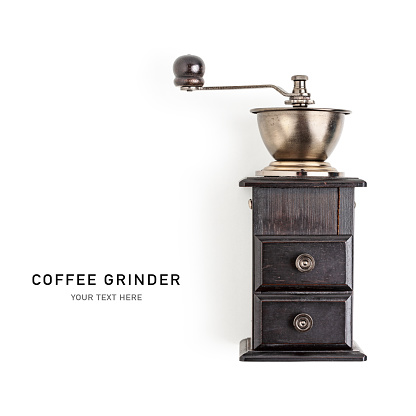 Antique manual coffee grinder isolated on white background