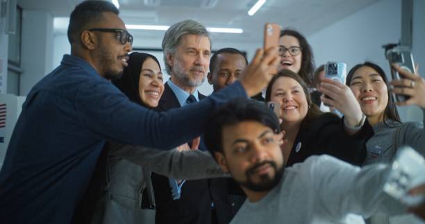 istock Multiethnic people come to presidential candidate after voting 2149119209