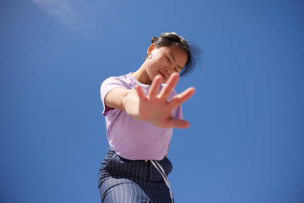 istock Empowering Reach: A Stylish Young Man's Confident Gesture 2149119283