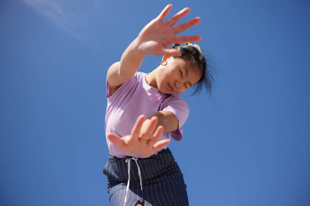 istock Energetic Beauty: A Young Woman's Dynamic Dance of Optimism 2149119285