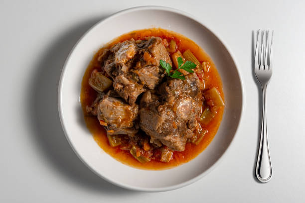istock Isolated Bowl with a portion of oxtail stewed vaccinara and fork 2149119348