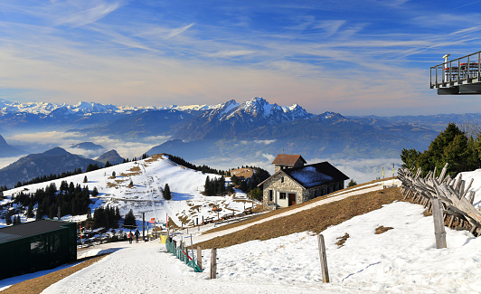 The Rigi, also known as Queen of the Mountains, is a mountain massif of the Alps, located in Central Switzerland. The whole massif is almost entirely surrounded by the water of three different bodies of water: Lake Lucerne, Lake Zug and Lake Lauerz.