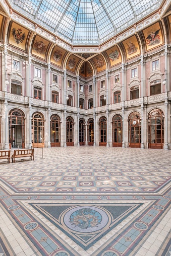 Porto, Portugal - October 31, 2023: Discovery of the Stock Exchange Palace (Palácio da Bolsa - 1834) Porto. Detail of the Pátio das Nações (Courtyard of Nations): the canopy and the ornate floor.