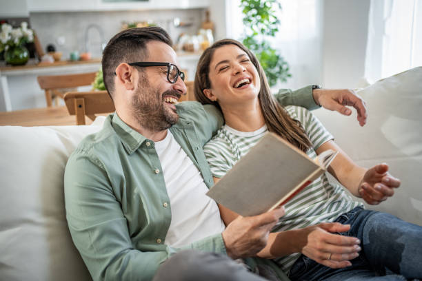istock Happy Caucasian couple relaxing at home 2149123636