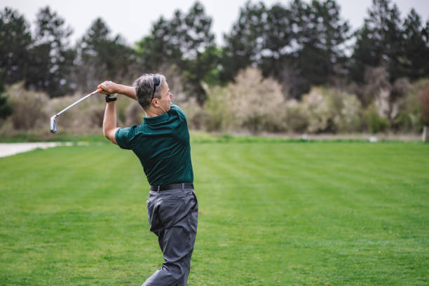 istock Portrait of a golfer taking a swing 2149123646