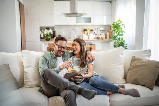 istock Happy Caucasian couple relaxing at home 2149123846