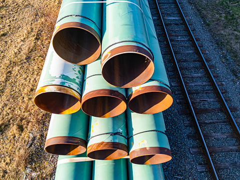 Decommissioned natural gas pipeline segments are transported by rail.
