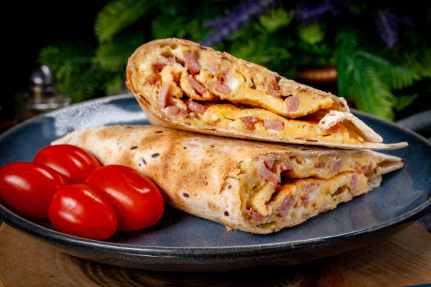 istock Tortilla multigrain with omelette, sausage and bacon. 2149124808