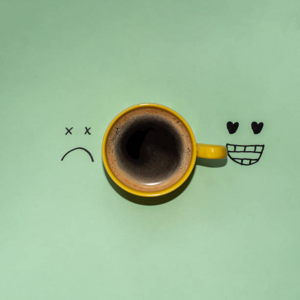 Creative coffee concept. Caffeine wakes you up concept on a green background with copy space.