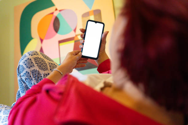 istock Senior woman using phone in bedroom 2149127116