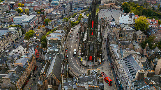 Aerial view of Edinburgh old town at night with Tolbooth Kirk Church, aerial view of the Old Town and Royal Mile in Edinburgh, The Hub high-spired church in Edinburgh city centre, Gothic Revival architecture in Scotland