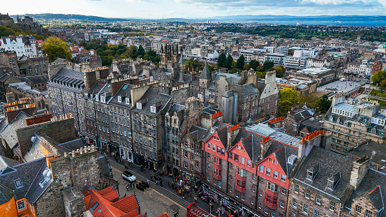 Aerial view of Edinburgh old town, Aerial view of Old cathedral in Edinburgh, Edinburgh city centre, Gothic Revival architecture in Scotland, Flag of Scotland in Edinburgh