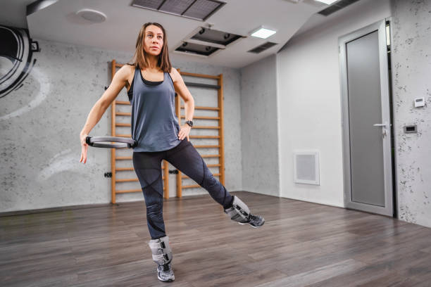 istock Woman exercising at the fitness studio 2149128263