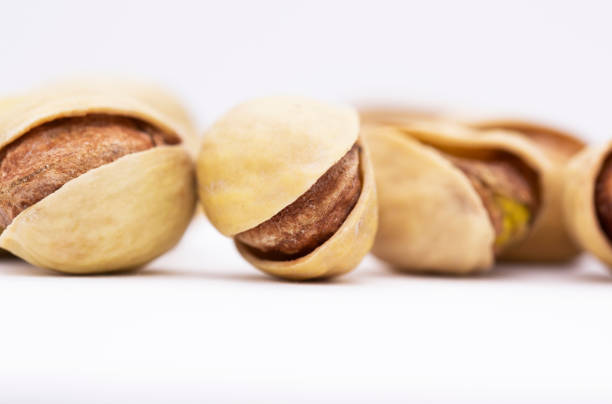 pistachios on a white background. dried nuts close up.
