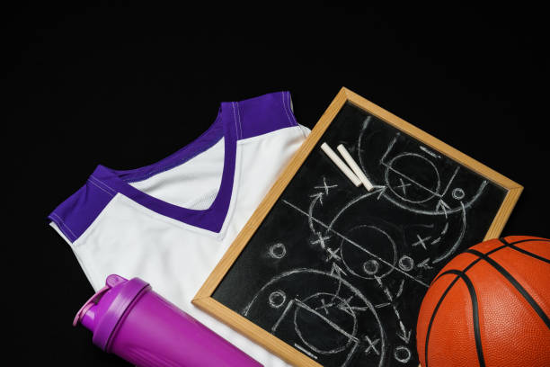 istock Basketball Strategy Planning With Chalkboard, Ball, and Jersey on Dark Background 2149128487