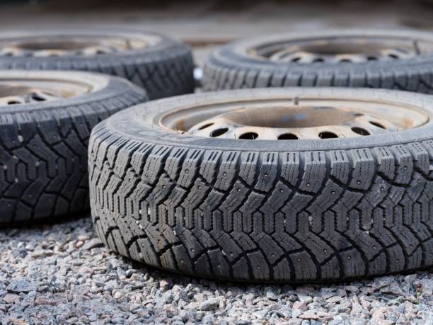 istock Four car wheels lying on the gravel. 2149129245