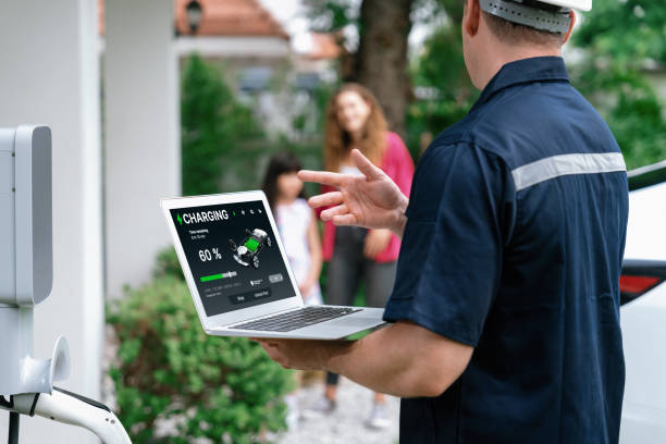 istock Qualified technician working with laptop for home EV station. Synchronos 2149129666
