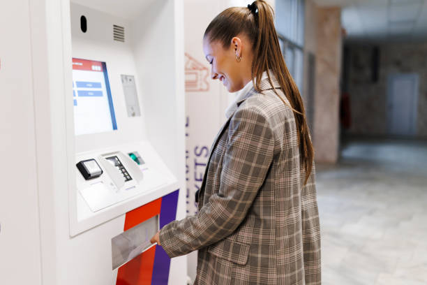 istock Woman buying a train ticket on the machine 2149130311