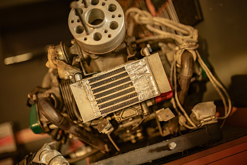 Photo capturing a disassembled aircraft engine, detailing its complex internal mechanics.