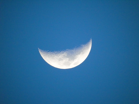 Photography of moon in the blue Sky. This picture was taken from central java Indonesia
