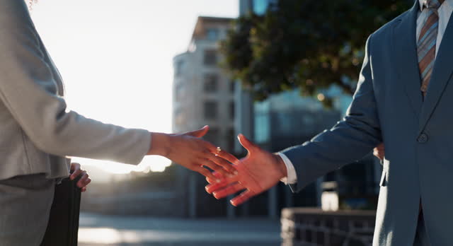 Business, people and handshake outdoors for welcome or greeting to career or corporate job, recruitment and hiring. Man, woman and shake hands for agreement or proposal for partnership deal and b2b.